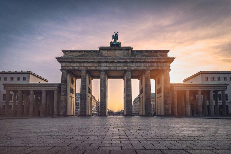 brandenburg gate illuminated sunset front view