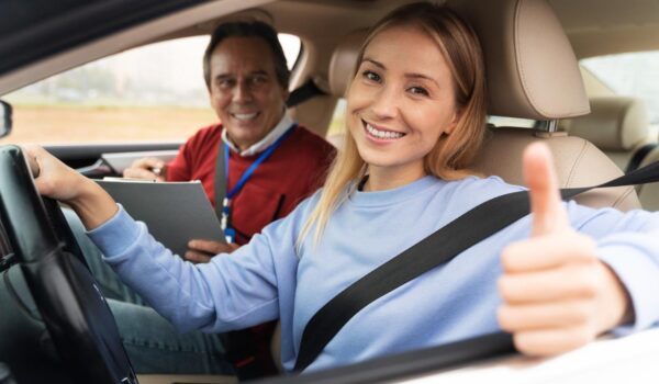 woman male driving instructor during driving test